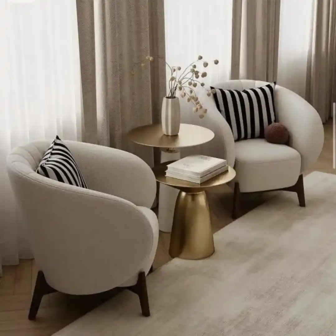 15 Small Living Room Decor Ideas That Feel Luxurious on a Budget 7 6. Swap a Sofa for Two Curved Accent Chairs